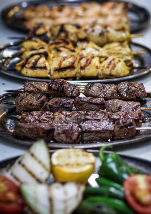 Grilled skewers of beef and chicken served with grilled vegetables at The Olive Restobar.